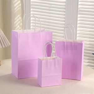 Three sizes of lilac macaron gift bags with white braided handles and serrated edge
