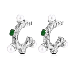 Detail of silver textured earrings with white pearls and green rectangular gemstone