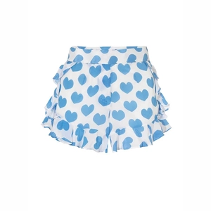 Detail of white shorts with blue heart print and sweet ruffle trim for summer beach wear