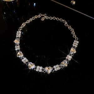 Detailed view of crystal heart necklace with adjustable silver chain and lobster clasp