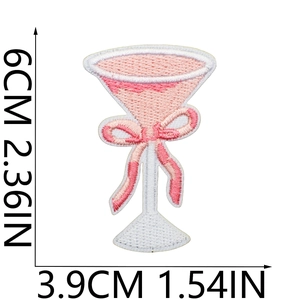 Detail showing dimensions of the martini glass embroidery patch with pink bow and texture