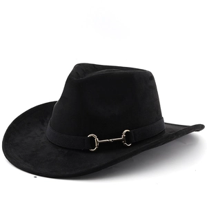 Detail of black faux suede cowboy hat with golden horsebit buckle on decorative band