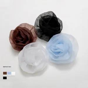 Three-dimensional layered mesh rose flower pins in coffee, black, white, and sky blue colors
