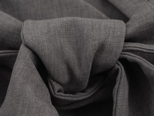 Vue macro détaillée de la texture du tissu gris foncé avec nœud décoratif