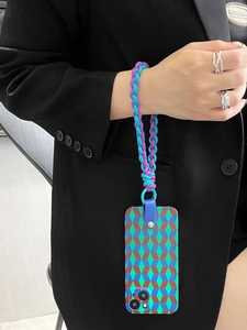 Detail of woven blue and purple wrist strap with geometric diamond pattern phone case