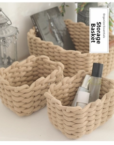 Detailed texture of hand-woven cotton rope storage baskets in a three-piece set