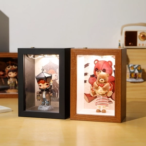 LED hollow frame showcase for art toys with black and wood finishes and backlight