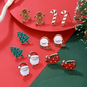Assorted Christmas stud earrings set featuring gingerbread man and tree icons