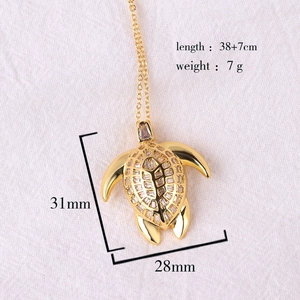 Detailed size specifications for a gold sea turtle pendant with colorful zircon stones