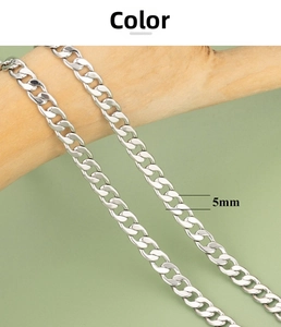 Close-up of 5mm wide silver flattened link chain on a wooden rod for DIY jewelry making