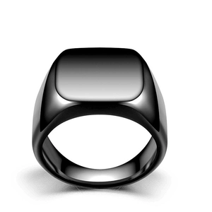Detailed view of square black titanium steel signet ring with a smooth polished surface