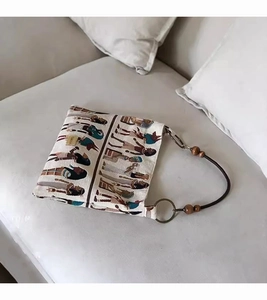 Detail of canvas tote with Egyptian jacquard, leather strap and decorative wood beads