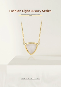 Detail view of a minimalist 18K gold necklace with a triangular white moonstone pendant