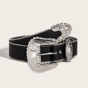 Close-up of Western vintage black leather belt with silver floral carved buckle and metal beads