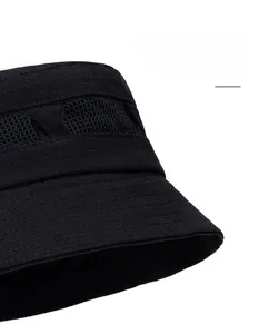 Close-up of black cotton sun hat with mesh vents and reinforced stitching on the wide brim