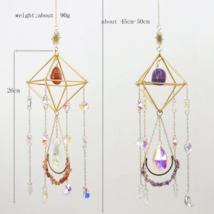 Detail view of crystal suncatcher showing the 26cm metal frame and natural stone accents