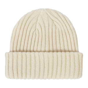 Detailed close-up showing the soft ribbed texture of a cream children's knit beanie