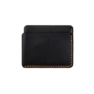 Detail of vintage black crazy horse leather card holder with orange contrast stitching