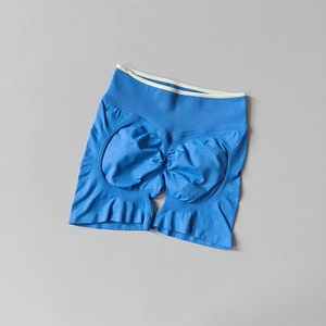 Macro detail of seamless sky blue yoga shorts featuring high waist and scrunch butt design