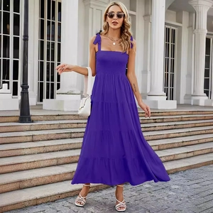 Purple tiered maxi dress with bow straps and ruffled bodice for a stylish summer look