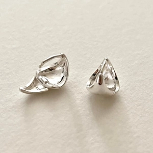 Close-up of S925 sterling silver stamp on the geometric triangular earring detail