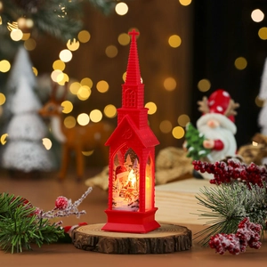 Detail shot of a red Christmas church lantern with warm LED light on wooden base
