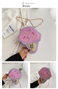 Detail of purple ice cream shaped crossbody bag with sequins and gold chain strap