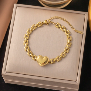 Polished gold heart charm bracelet with Roman numeral links and adjustable chain