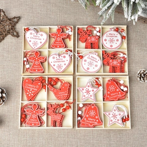 Close-up of wooden Christmas ornaments set including heart, star and angel on linen background