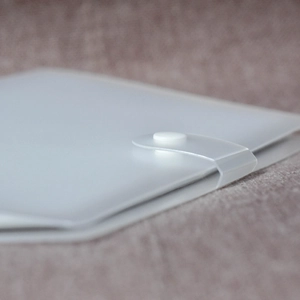 Close-up of a frosted PP translucent organizer with a white snap button closure
