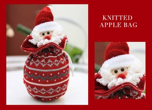 Detail of Santa Claus knitted Christmas gift bag with drawstring and festive red textures