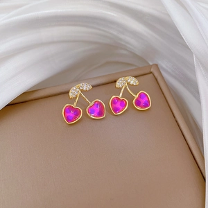Detail of titanium steel cherry earrings with pink crystal hearts and clear diamonds