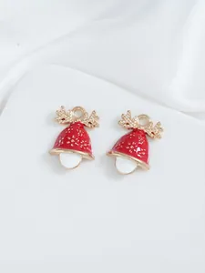 Detail of red enamel Christmas bell pendants with gold glitter and reindeer antler top
