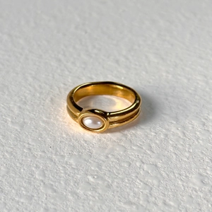 Minimalist 18k gold plated titanium ring featuring dual-track design and white freshwater pearl
