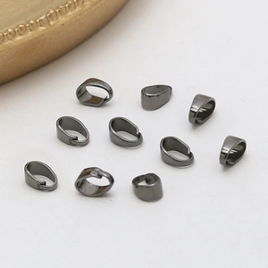 Macro shot of 10 gunmetal grey pendant clasp connectors for DIY jewelry making
