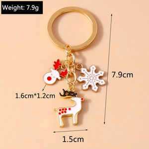 Detail view of Christmas keychain with elk, reindeer, and snowflake pendants and measurements