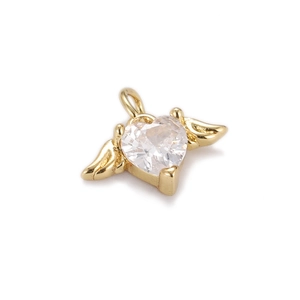 Macro view of gold-plated angel wing heart pendant with sparkling cubic zirconia stone