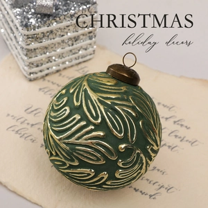 Retro dark green Christmas ball with gold embossed leaf texture on vintage paper