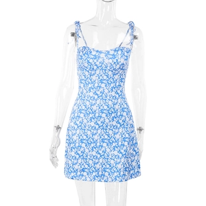 Detailed close-up of blue floral dress featuring adjustable tie straps and slim fit design
