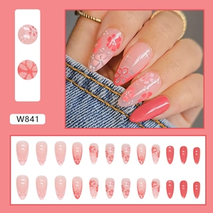 Pink stiletto press-on nails with floral patterns, leopard glitter, and 24-piece full set