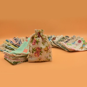 Collection of printed cotton drawstring pouches with various floral and animal patterns