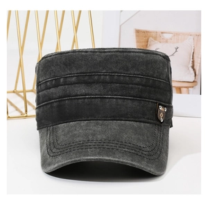 Detail of vintage washed cotton flat top military cap with a retro metal side badge