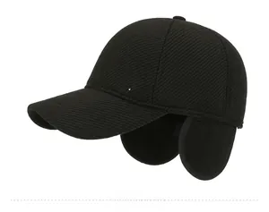 Detail view of winter baseball cap featuring ear flaps and M SPORT metal lettering