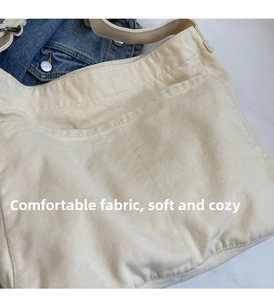 Detailed macro view of heavy-duty cream cotton canvas texture with durable weave