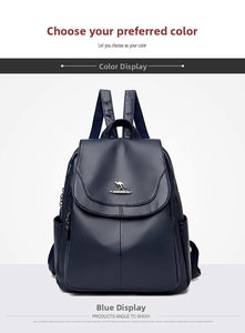 Detailed view of dark blue leather backpack featuring pebble texture and gold kangaroo logo