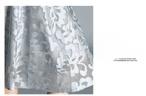 Detailed macro shot of elegant floral lace embroidery fabric in light blue with sheer cutouts