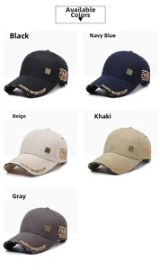 Detail view of embroidered letters and metal logo on various colored baseball caps