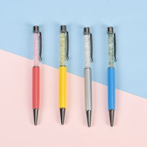 Set of four metal crystal ballpoint pens in pink yellow silver and blue tones