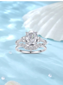 Detail view of S925 hallmark on silver ring set with oval cut crystal on silk