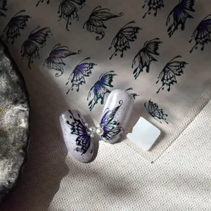Thin flexible 5D nail art stickers featuring purple butterfly designs with pearl accents